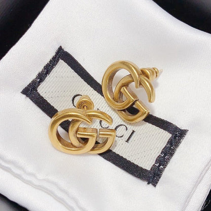 Boucles d'oreilles clous polyvalentes avec logo