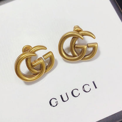 Boucles d'oreilles clous polyvalentes avec logo