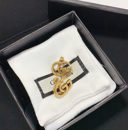 Boucles d'oreilles clous polyvalentes avec logo