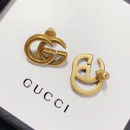 Boucles d'oreilles clous polyvalentes avec logo