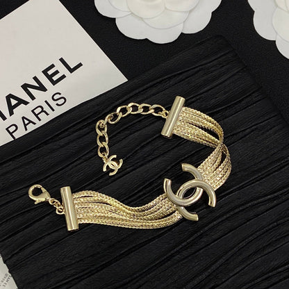 Set di 3 articoli con nappa e design CC (orecchini + bracciale + collana) - Oro